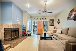 Living room with tile patterned flooring, a firep