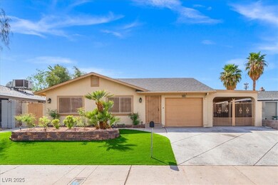 Ranch-style home with a garage, concrete driveway,