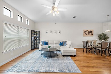 Light streams into this open-concept living and di