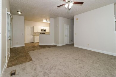Unfurnished living room with ceiling fan, light co