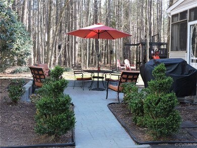 Stamped concrete patio leads you to a very private