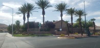 View of asphalt road with curbs, street lighting,