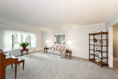 Large open formal living with bay window.