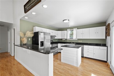 Kitchen is complete with Granite countertops, brea