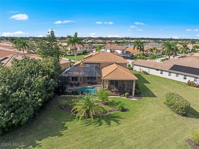 Aerial view of rear of home, showing large back ya