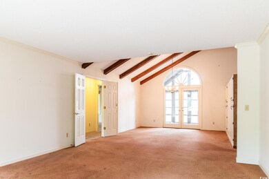 Living Room to Dining Room with french doors and v