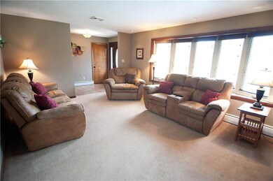 The living room welcomes you with a new bay window