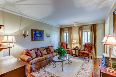 A formal living room is located right off the entr