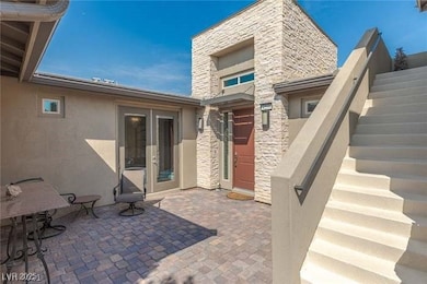 View of patio featuring french doors and stairway