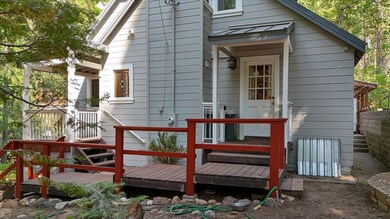 Rear view of property featuring a deck