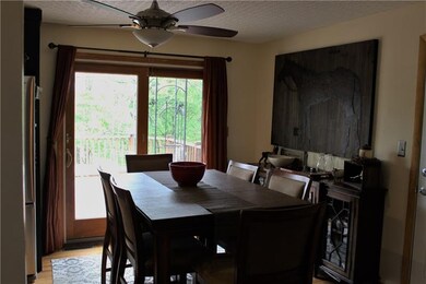 Dining Room with its view of the back deck and woo