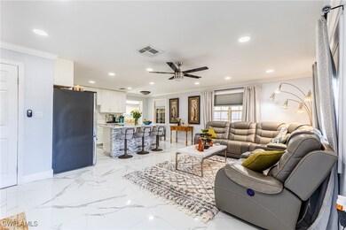 Living room with marble finish floor, ornamental m