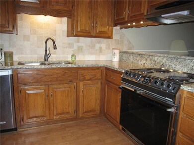New granite and back splash and nice task lighting
