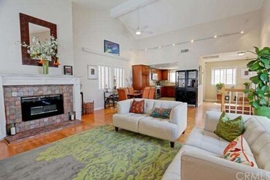 Close up shot of the fireplace and vaulted ceiling