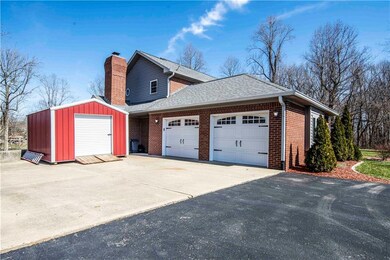 2 car garage w/shed and tons of room for parking your cars and boat here and in the driveway.