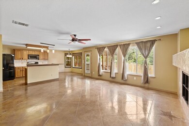 Unfurnished living room with ceiling fan, recesse