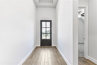 As you enter the home, you’re greeted by a spaciou