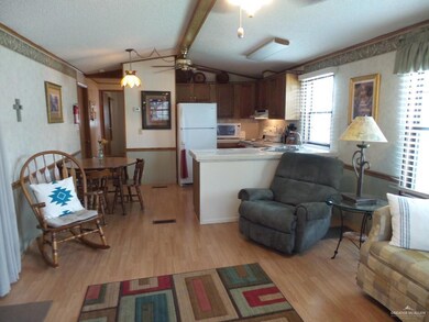 Living room, dining room, and kitchen area