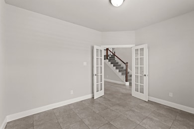 The glass doors offer the option to keep the space visually connected to the rest of the home while still providing a degree of separation for focus and quiet.