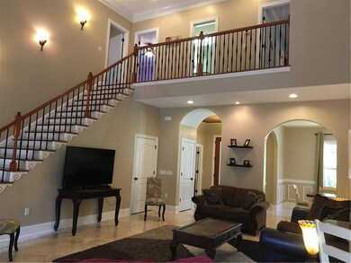 Tall Arched doorways in living area and custom det