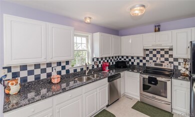 Beautiful kitchen with black & white tile backspla