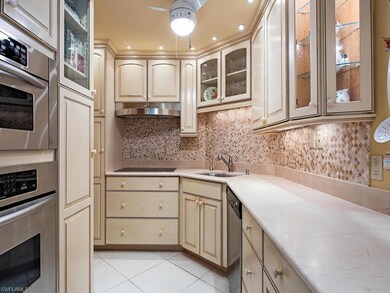 Kitchen with tasteful backsplash, stainless steel 