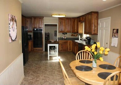 From Eat-in area to the 23x13 Kitchen w/ plenty of cabinetry; built-in oven; wainscoting; Dishwasher, Refrigerator...