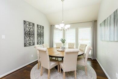 Simply elegant...The dining room delicately showcases the highly desired HGTV grey paint tones that highlight the majority of the home.