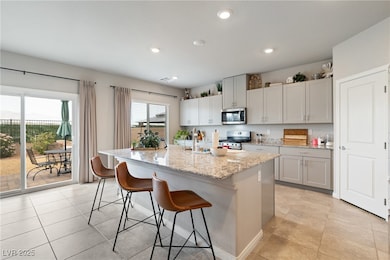 Kitchen with a breakfast bar, stainless steel appl