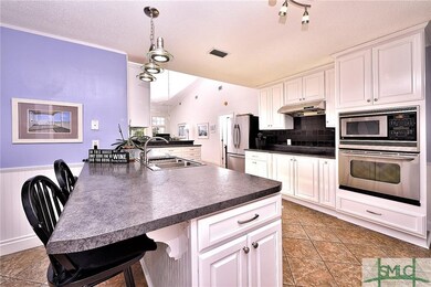 HUGE kitchen with stainless appliances, triple sin
