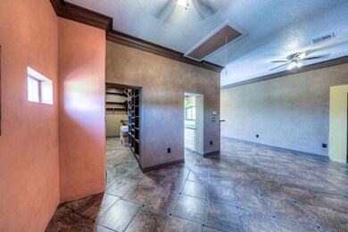 Bedroom space tile floor. Custom designed closet,