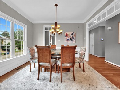 Dining room with a notable chandelier, hardwood /