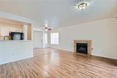 Unfurnished living room featuring ceiling fan, lig