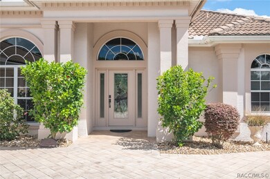 Welcoming covered entry with stained glass entry d