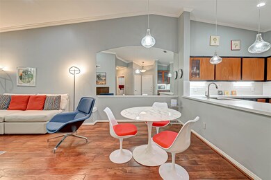 The large arched mirrored wall with chair rail adds a bit of drama to the dining area.