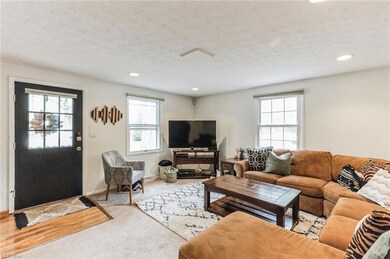 Living room featuring a textured ceiling and light