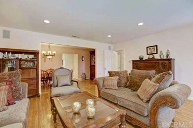 Formal living room is adjacent to the formal dinin