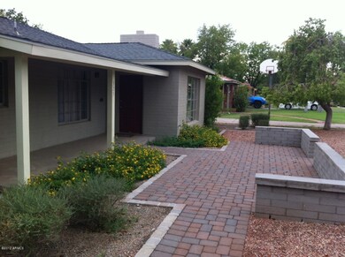 custom front patio with pavers/wall