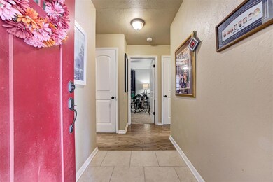 Hall featuring light wood-type flooring and a text
