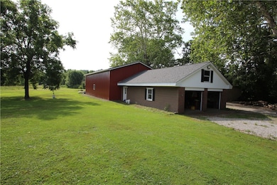 View of 4 Car Detached Garage w/ Loft connected to Brand New 50x30 3 Bay Garage