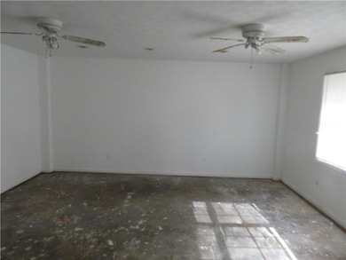 Unfurnished room with a ceiling fan