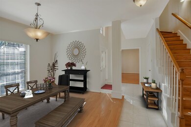 Formal dining room has large window views and plenty of space for gatherings.  Virtually staged.