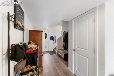 Hallway with light hardwood / wood-style floors an