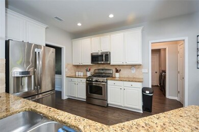 Inviting Kitchen features granite counter tops, stainless steel appliances and is open to great room