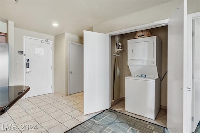 Laundry room featuring light tile patterned floors
