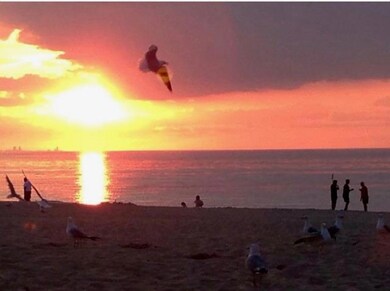 SUN RISING ON THE BEACH