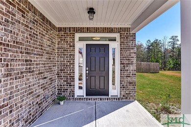 Covered entry with gorgeous brick.