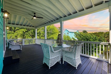 Deck at dusk featuring ceiling fan and outdoor dining space