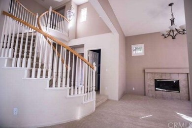 Formal living room with gas log fireplace.