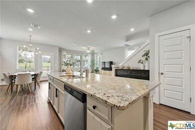 Another shot of the island shows the dish washer and a coat closet.